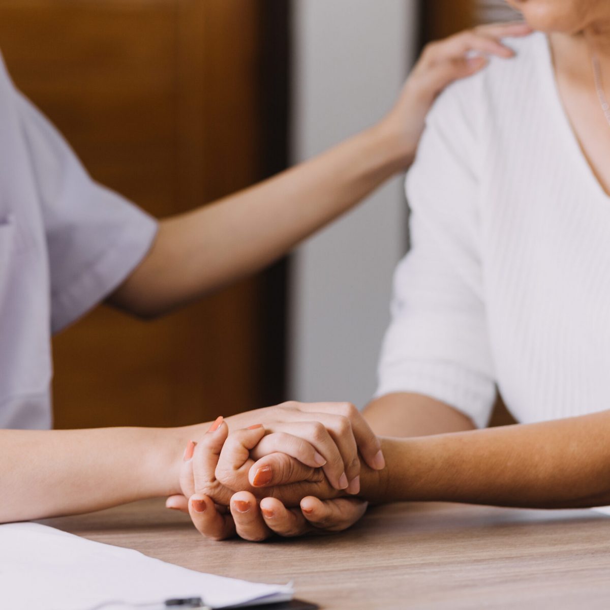 Homecare nursing service and elderly people cardiology healthcare. Close up of young hispanic female doctor nurse check mature caucasian man patient heartbeat using stethoscope during visit